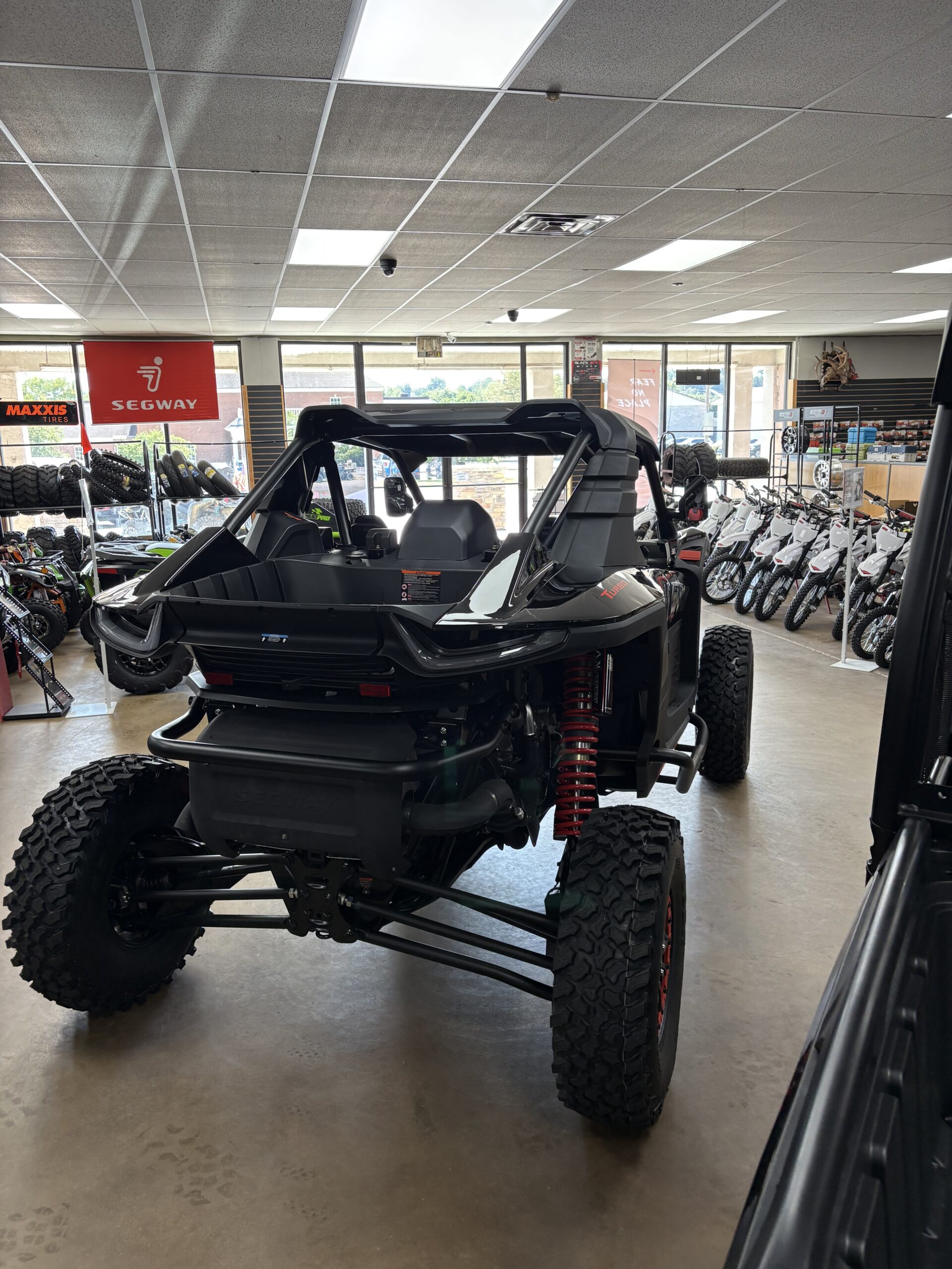 Performance vehicle and tire racks inside Ison Powersports